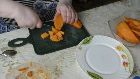 The chef cuts the pumpkin with a knife Stock Footage 139132126
