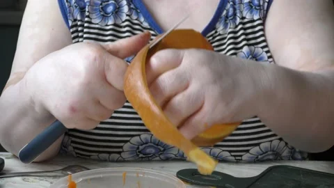 The chef cuts the pumpkin with a knife Stock Footage 139132282