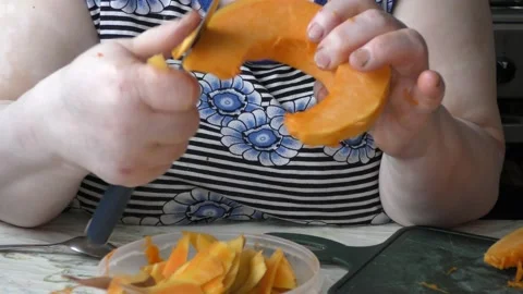 The chef cuts the pumpkin with a knife Stock Footage 139132378