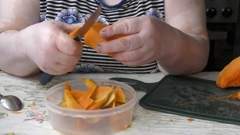 The chef cuts the pumpkin with a knife Stock Footage 139132465