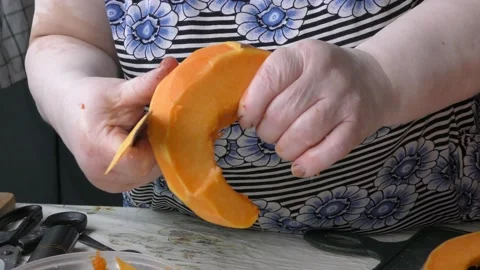The chef cuts the pumpkin with a knife Stock Footage 139132543