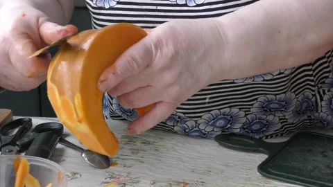 The chef cuts the pumpkin with a knife Stock Footage 139132606