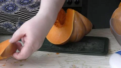 The chef cuts the pumpkin with a knife Stock Footage 139132804