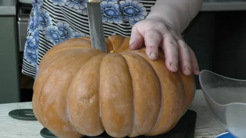 The chef cuts the pumpkin with a knife Stock Footage 139133039