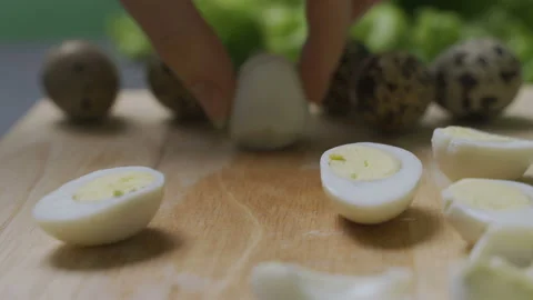 Chef cuts quail eggs Stock Footage 101372206