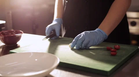 Chef cuts the quail eggs for salad. Stock Footage 68850227