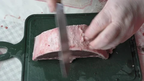 Chef cuts raw deer meat with a knife Video stock 167106133
