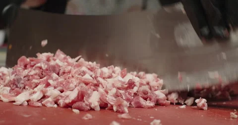 Chef cuts raw meat with fat with a big knife. Handmade ground meat. Close-up Stock-Footage 260656965