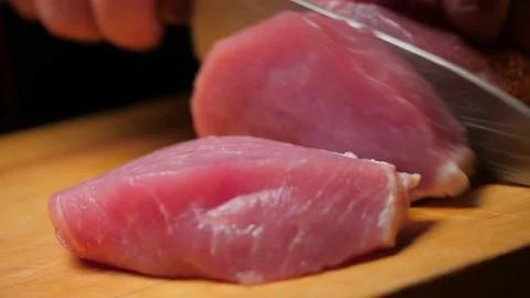 The chef cuts raw meat Video stock 146396817