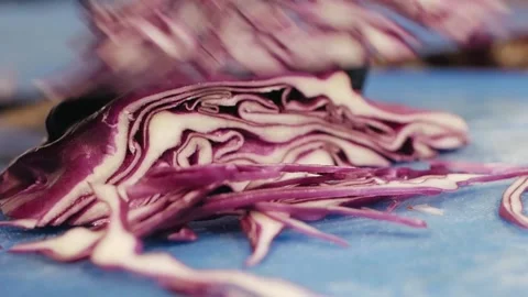 The chef cuts the red cabbage Stock Footage 147024975