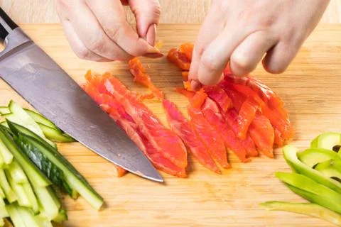 The chef cuts red fish Foto stock