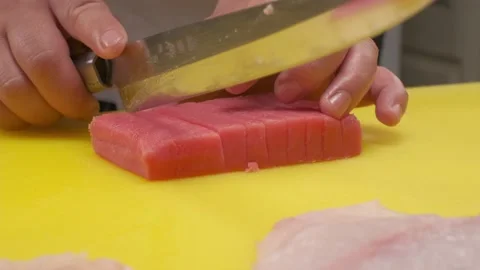 The chef cuts the red fish into slices on a board Stock Footage 227536023