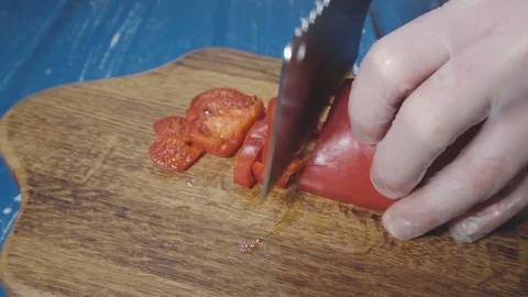 Chef cuts the red pepper Stock Footage 73816297