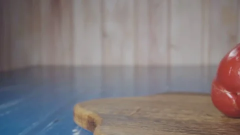 Chef cuts the red pepper in half Stock Footage 73816283