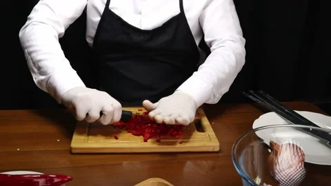 Chef cuts red peppers 스톡 동영상 190080341