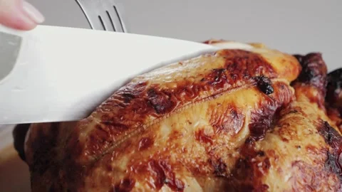 Chef cuts the roasted chicken, chopping tasty grilled chicken. Stock Footage 310562239