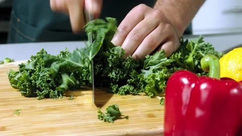 Chef cuts the salad slow motion Stock Footage 153766824