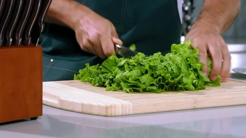Chef cuts the salad slow motion Stock Footage 221850127