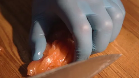 Chef cuts salmon for cooking Stock Footage 158021819
