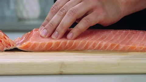 Chef cuts the salmon slow motion Video stock 219733543