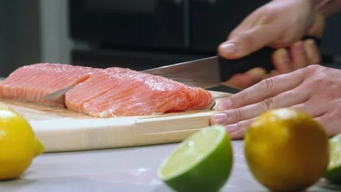 Chef cuts the salmon slow motion Stock Footage 219733545