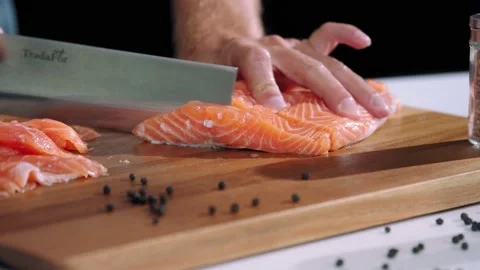 Chef cuts the salmon slow motion Stock Footage 221503195