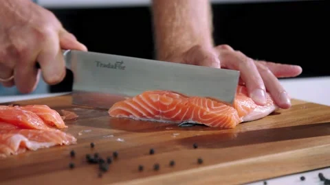 Chef cuts the salmon slow motion Stock Footage 223220673