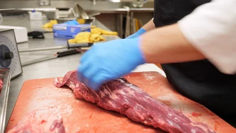 Chef cuts silverskin trims silverskin of tenderloin beef zermatt utah z's ste Stock Footage