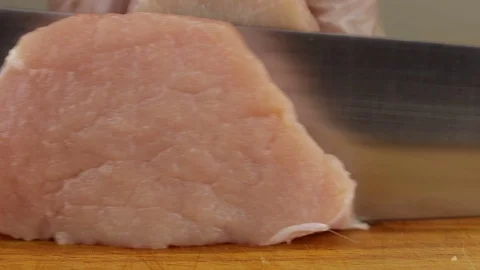 Chef cuts a slice of meat Stock Footage 122133678
