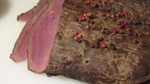 The chef cuts the smoked meat into thin slices Stock Footage 157981121