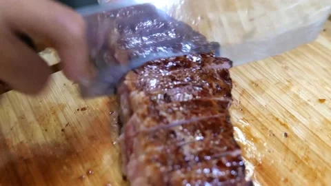 The chef cuts the steak Stock Footage 171737057