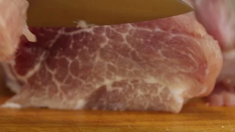 Chef cuts a thin slice of meat Stock Footage 122133693