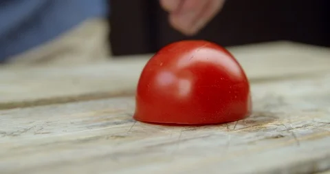 Chef cuts tomato on the Board Stock Footage 113423230