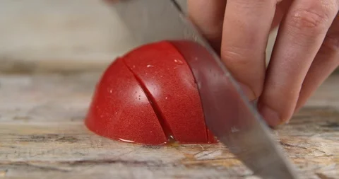 Chef cuts tomato on the Board Stock Footage 113424045