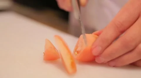 Chef cuts the tomato closeup Stock Footage 61156834