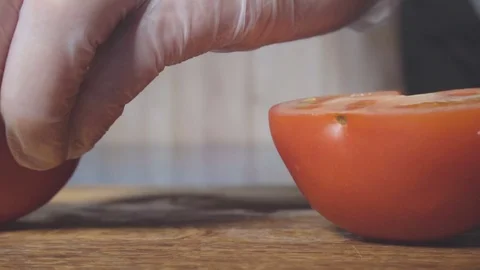 Chef cuts the tomato Stock Footage 73816311