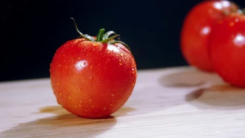Chef cuts the tomato slow motion Stock Footage 233005121