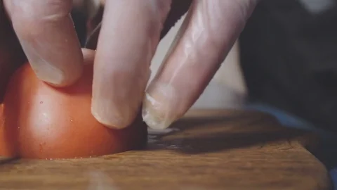 Chef cuts the tomato in small pieces Stock Footage 73816323