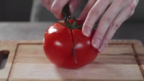 Chef cuts the tomato vegetable salad Stock Footage 143777523