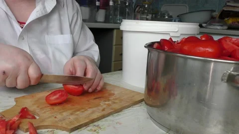 The chef cuts the tomatoes with a knife Stock Footage 138719401