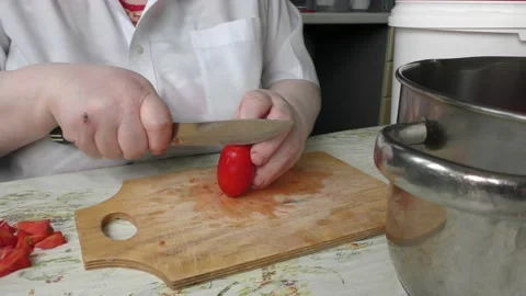 The chef cuts the tomatoes with a knife Stock Footage 138720140