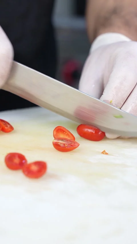 Chef Cuts Tomatoes With Knife Video stock 296023319