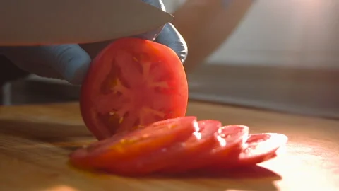 Chef cuts tomatoes for salad Stock Footage 158021633