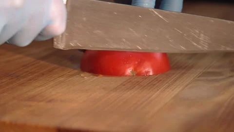 Chef cuts tomatoes for salad Stock Footage 158021724