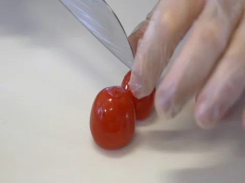 The chef cuts the tomatoes. Slow motion Stock Footage 76049268