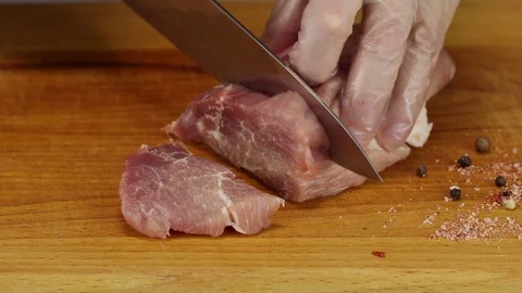 Chef cuts two slices of meat Stock Footage 122133676