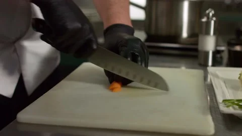 The chef cuts vegetables in the kitchen. Close up Stock Footage 131152044