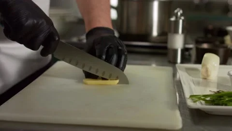 The chef cuts vegetables in the kitchen. Close up Stock Footage 131152047