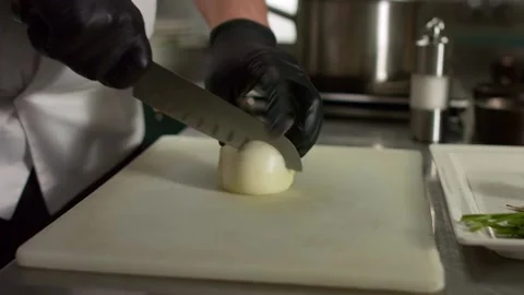 The chef cuts vegetables in the kitchen. Close up Stock Footage 131152049