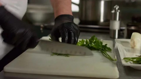 The chef cuts vegetables in the kitchen. Close up Stock Footage 131152060